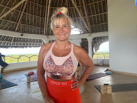 Women wearing the pink Tigers Eye bra to a yoga session