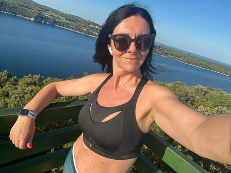 Customer picture: wearing the black Tigers Eye bra on holiday with a lake view.