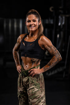 Ex-Military transformation coach wearing the black Tigers Eye bra in Army greens.