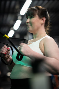 UK Army veteran and athlete training in the white Tigers Eye bra. 