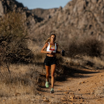 Whitney Dancaster, ultra runner wearing the white Tigers Eye bra for the Juvelina Jundred race.